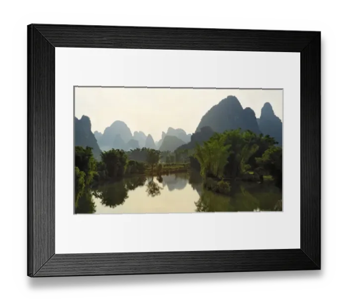 Framed Print : Bamboo and karst formations reflected in small pond along the Yulong River, China Framed Print : Bamboo and karst formations reflected in small pond along the Yulong River, China