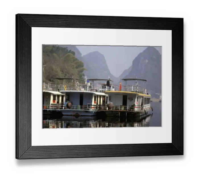 Framed Print : China, Guangxi province. Colorful river tour boats moored along the shore- Li river Framed Print : China, Guangxi province. Colorful river tour boats moored along the shore- Li river
