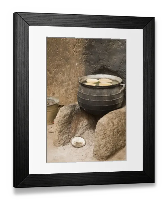 Framed Print : West Africa, Africa, Ghana, Nakpa. Pot on stove against wall of traditional mud dwelling Framed Print : West Africa, Africa, Ghana, Nakpa. Pot on stove against wall of traditional mud dwelling