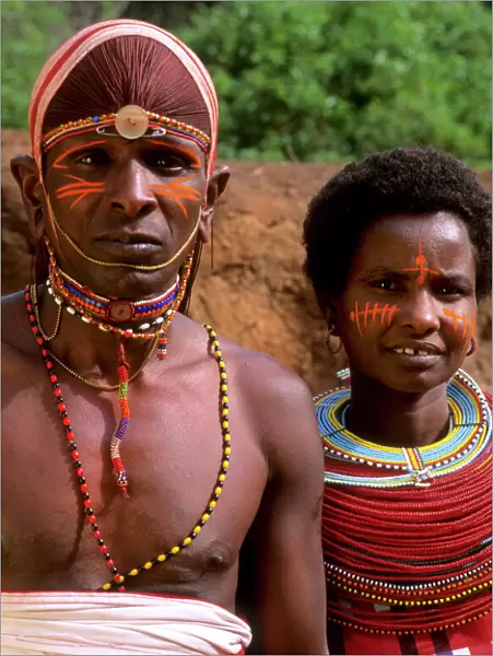 Msai tribe people couple in costume traditional dress in jungles near hut near Kenya Africa