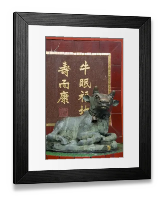 Framed Print : Hong Kong, Hong Kong Island. Goddess of Mercy temple at Repulse Bay. Bronze cow statue