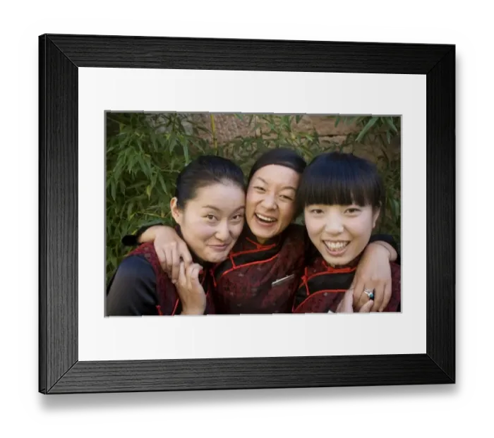 Framed Print : Reception girls in Naxi-style dress at spa resort, Jade Dragon Snow Mountain Valley outside Lijiang
