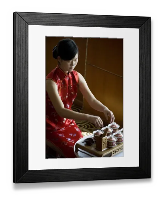 Framed Print : Tea hostess prepares for a Chinese tea tasting aboard a luxury Yangzi River cruise ship Framed Print : Tea hostess prepares for a Chinese tea tasting aboard a luxury Yangzi River cruise ship