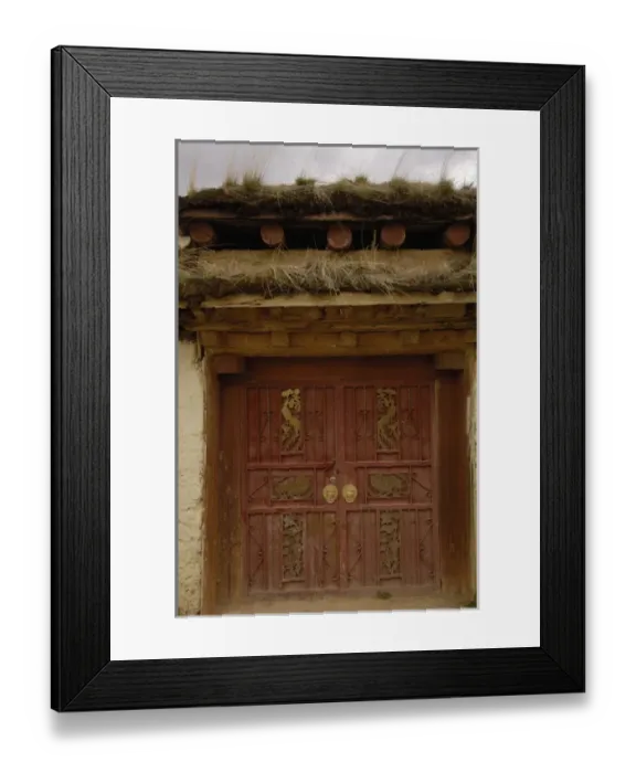 Framed Print : Tibetan house door ornately carved. Zhongdian. Deqin Tibetan Autonymous Prefecture
