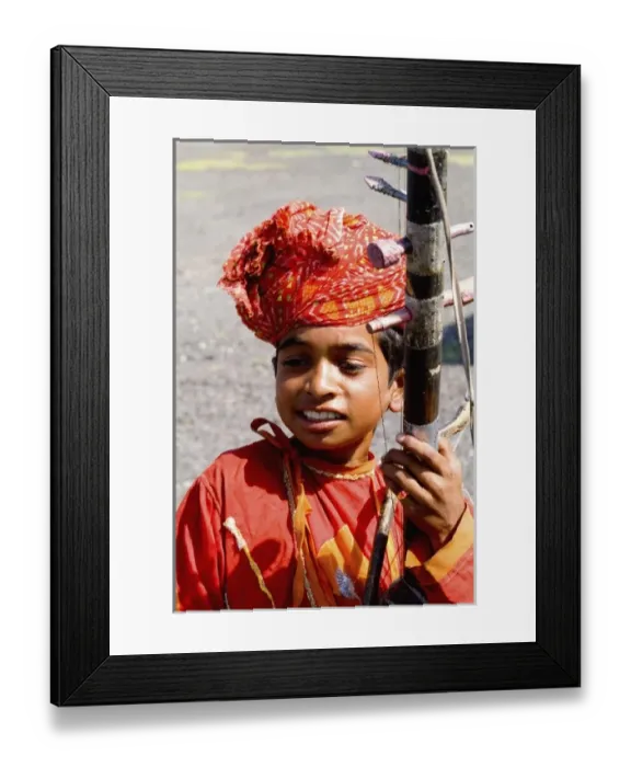 Framed Print : Young boy aged 10 with musical instrument called Sarangi on road to Jodhpur in Rajasthan India