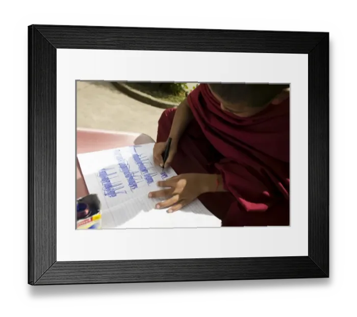 Framed Print : Young monk practicing calligraphy, Dharamsala, India
