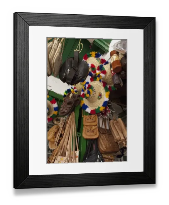 Framed Print : Morocco, Tetouan. Historic medina bazaar. Typical leather & souvenir shop with traditional Framed Print : Morocco, Tetouan. Historic medina bazaar. Typical leather & souvenir shop with traditional