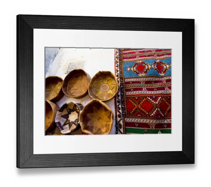 Framed Print : Fez Morocco leather baskets & oriental carpet on the wall in the old medina Framed Print : Fez Morocco leather baskets & oriental carpet on the wall in the old medina