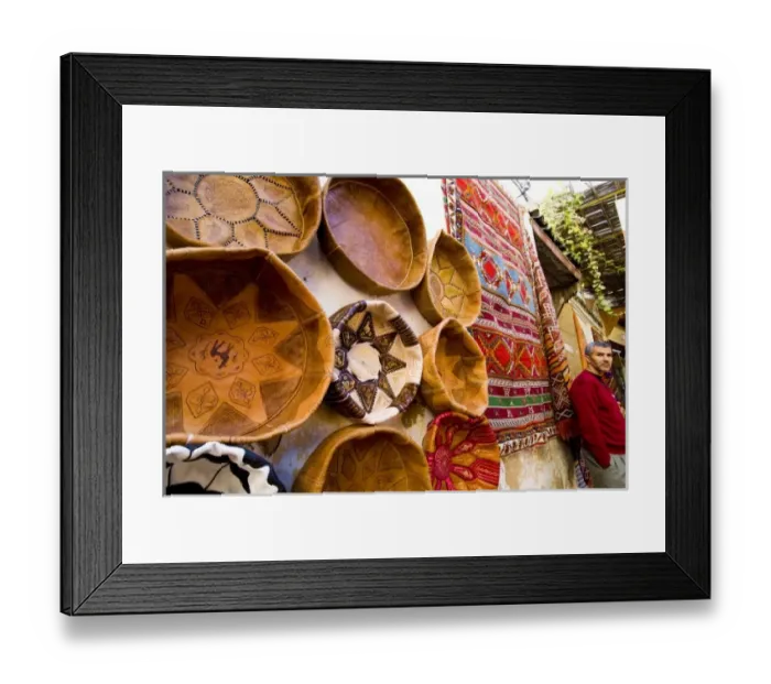 Framed Print : Fez Morocco leather baskets & Oriental carpet and proprietor in the old medina Framed Print : Fez Morocco leather baskets & Oriental carpet and proprietor in the old medina