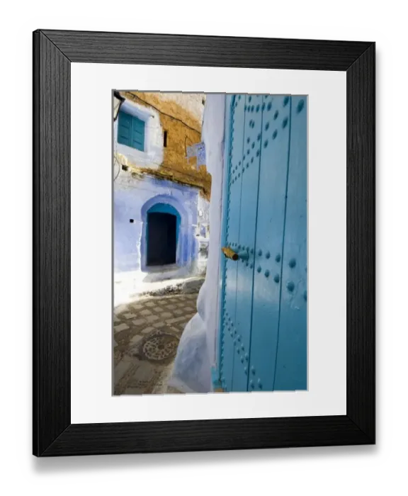 Framed Print : Chefchaouen Morocco narrow street with blue doors in the medina Framed Print : Chefchaouen Morocco narrow street with blue doors in the medina