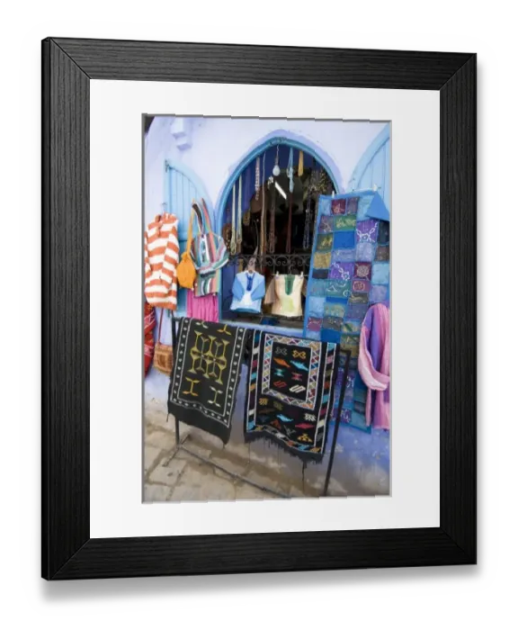 Framed Print : Chefchaouen Morocco tourist shop selling clothes, bags, rugs and wall hangings in