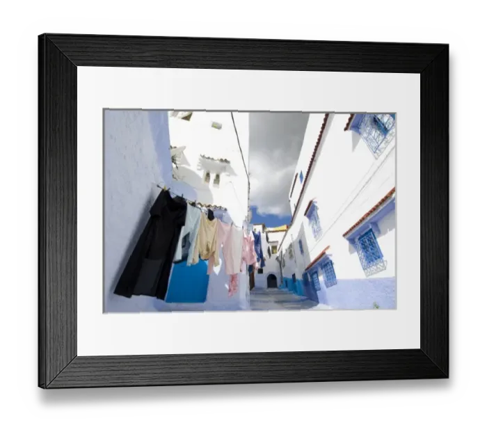 Framed Print : Chefchaouen Morocco laundry hanging against the white and blue washed wall in the medina Framed Print : Chefchaouen Morocco laundry hanging against the white and blue washed wall in the medina