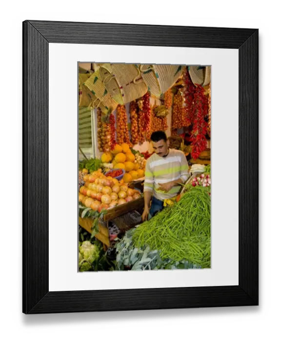 Framed Print : Tangier Morocco Moroccan fruit & vegetable seller in stall at the covered market Framed Print : Tangier Morocco Moroccan fruit & vegetable seller in stall at the covered market