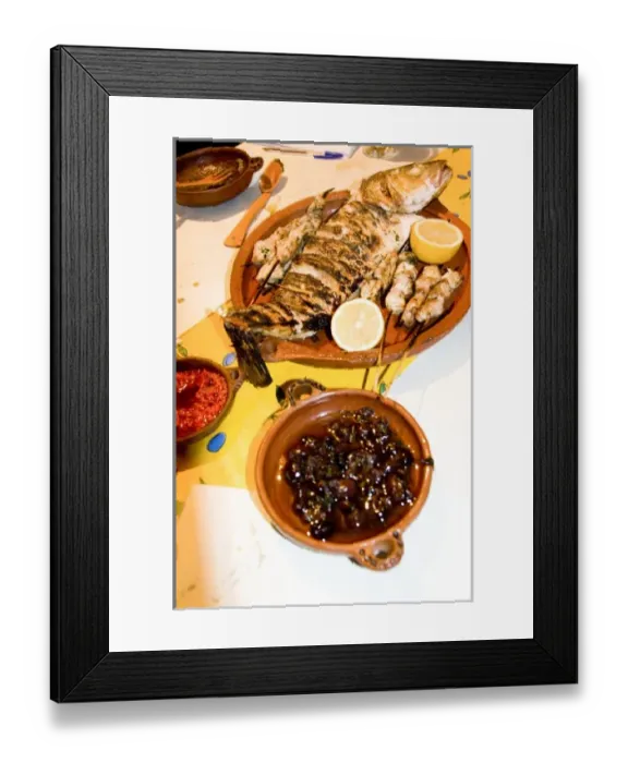 Framed Print : Tangier Morocco clay dishes holding olives, peppers and whole fish in fish restaurant Framed Print : Tangier Morocco clay dishes holding olives, peppers and whole fish in fish restaurant