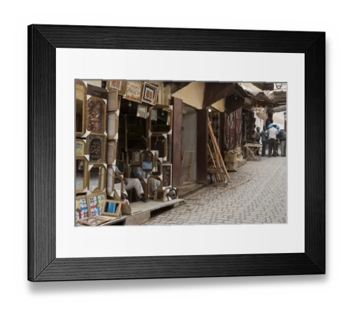 Framed Print : Merchant outside his stall in the Medina Fes, Middle Atlas, Morocco Framed Print : Merchant outside his stall in the Medina Fes, Middle Atlas, Morocco