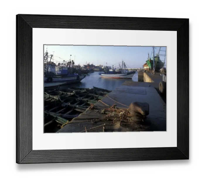 Framed Print : Africa, Morocco, Morning sun lights fishing boats in shipyard outside walled medina Framed Print : Africa, Morocco, Morning sun lights fishing boats in shipyard outside walled medina