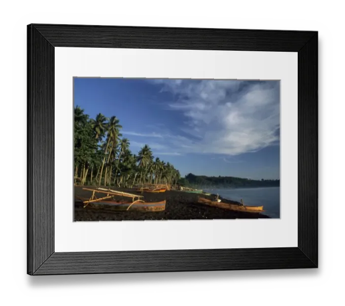 Framed Print : Indonesia, Sulawesi, Batupitih. Palm trees and perahu fishing boats on black sand beach Framed Print : Indonesia, Sulawesi, Batupitih. Palm trees and perahu fishing boats on black sand beach