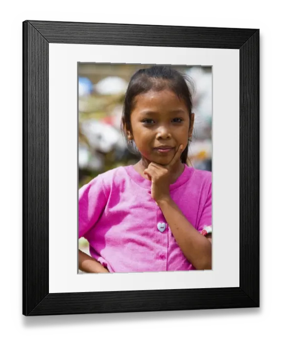 Framed Print : Bali, Indonesia. It is common to see families living, and children playing, in dangerously Framed Print : Bali, Indonesia. It is common to see families living, and children playing, in dangerously