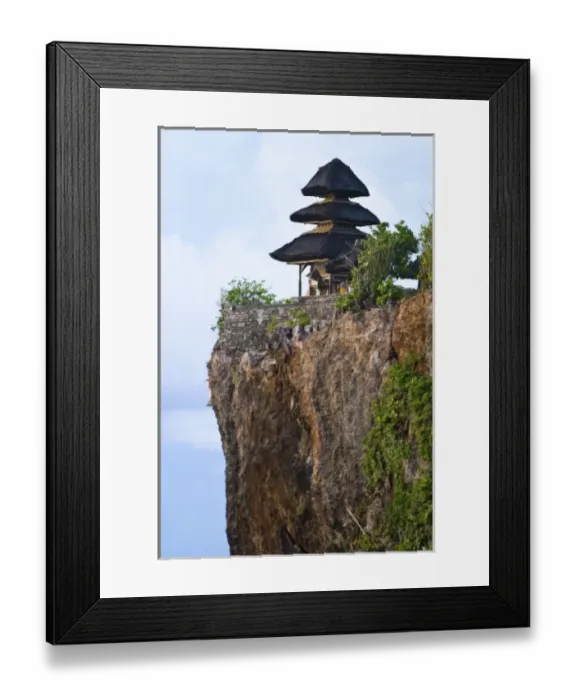 Framed Print : Bali, Indonesia. Uluwatu temple is one of the many famous landscape temples overlooks the ocean Framed Print : Bali, Indonesia. Uluwatu temple is one of the many famous landscape temples overlooks the ocean