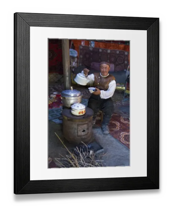 Framed Print : Kazakh man drinking tea in his yurt. (MR) Framed Print : Kazakh man drinking tea in his yurt. (MR)