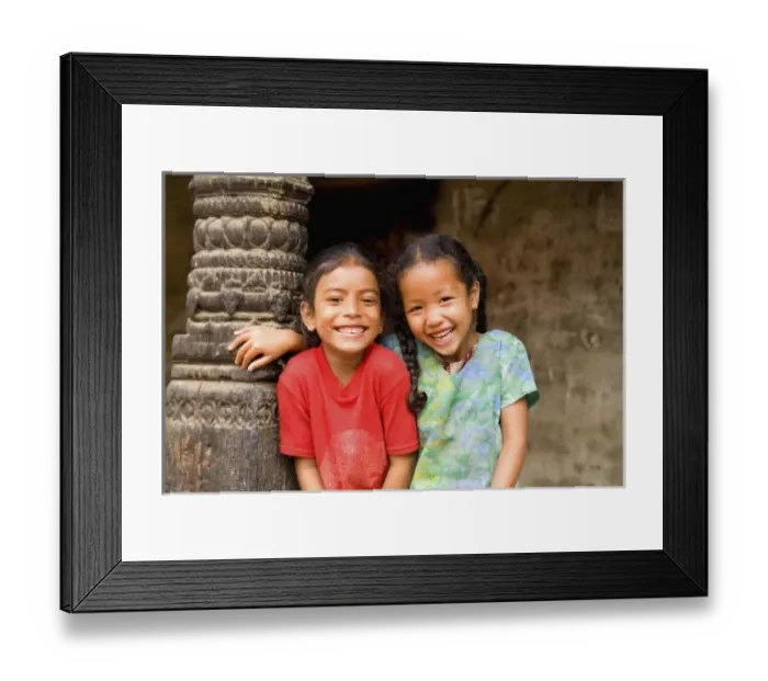 Framed Print : Beautiful young children laughing aged 6 and 7 having fun in village of Bhaktapur