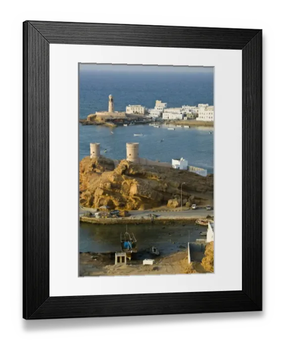 Framed Print : Oman, Sharqiya Region, Sur. Towers of Al Ayajh Fort / Sur Bay / Late Afternoon Framed Print : Oman, Sharqiya Region, Sur. Towers of Al Ayajh Fort / Sur Bay / Late Afternoon
