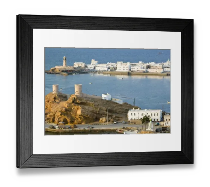 Framed Print : Oman, Sharqiya Region, Sur. Towers of Al Ayajh Fort  /  Sur Bay  /  Late Afternoon