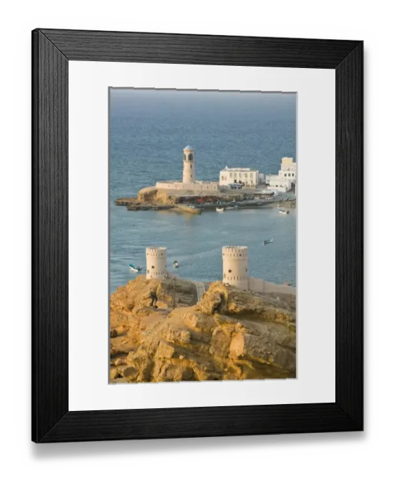 Framed Print : Oman, Sharqiya Region, Sur. Towers of Al Ayajh Fort / Sur Bay / Late Afternoon Framed Print : Oman, Sharqiya Region, Sur. Towers of Al Ayajh Fort / Sur Bay / Late Afternoon