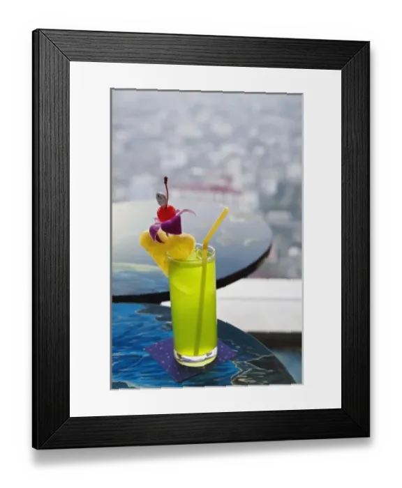 Framed Print : Traditional Thai drink on table in restaurant high above Bangkok, Thailand Framed Print : Traditional Thai drink on table in restaurant high above Bangkok, Thailand