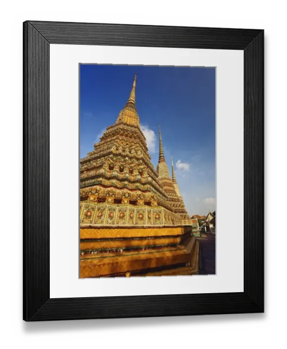 Framed Print : Upward view of trio of chedi at Wat Pho, the oldest temple in Bangkok, Thailand Framed Print : Upward view of trio of chedi at Wat Pho, the oldest temple in Bangkok, Thailand