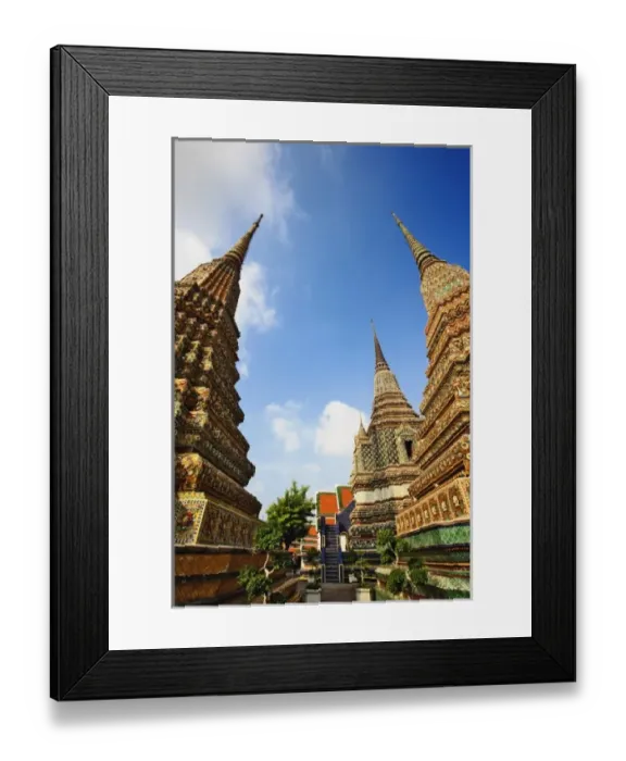 Framed Print : Upward view of chedis including distant Phra Si Sanphet Chedi, Wat Pho, Bangkok, Thailand Framed Print : Upward view of chedis including distant Phra Si Sanphet Chedi, Wat Pho, Bangkok, Thailand