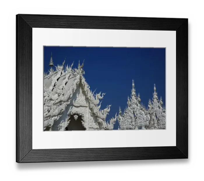 Framed Print : Rooftop architectural details of the new all white temple of What Rong Khun in Tambon