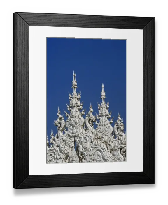 Framed Print : Rooftop architectural details of the new all white temple of Wat Rong Khun in Tambon