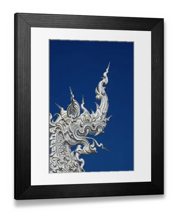 Framed Print : Rooftop architectural detail of dragon head on the new all white temple of Wat Rong Framed Print : Rooftop architectural detail of dragon head on the new all white temple of Wat Rong