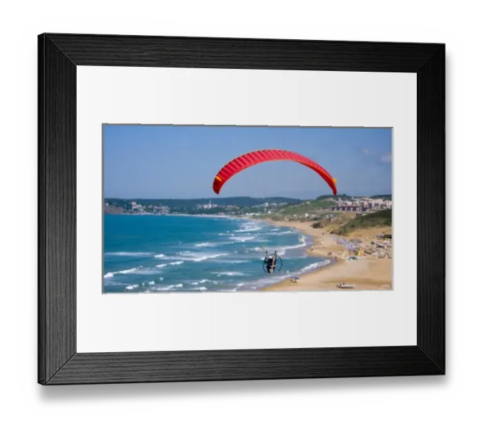 Framed Print : Powered paraglider flying over Gumusdere beach on the Black Sea coast of Istanbul