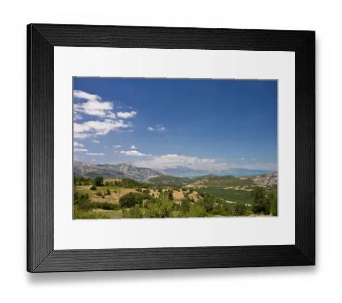 Framed Print : View of Lake Egirdir beyond hilly green land, Isparta, Turkey