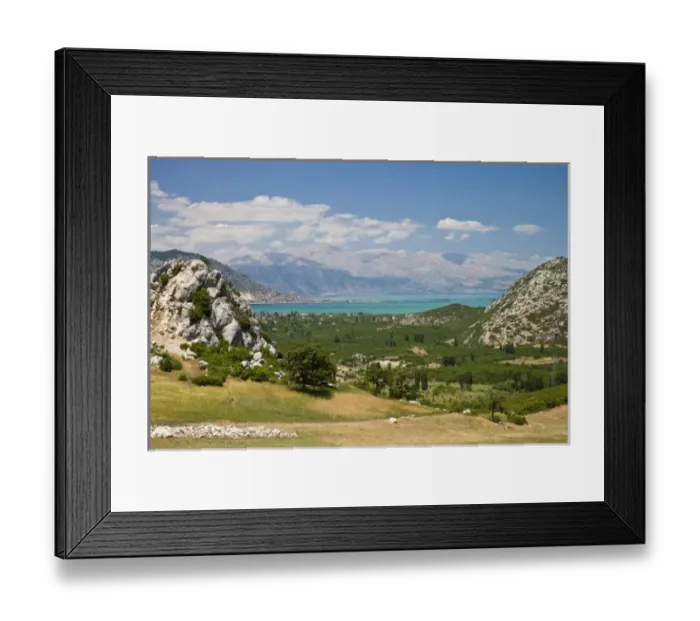 Framed Print : View of Lake Egirdir beyond hilly green land, Isparta, Turkey Framed Print : View of Lake Egirdir beyond hilly green land, Isparta, Turkey