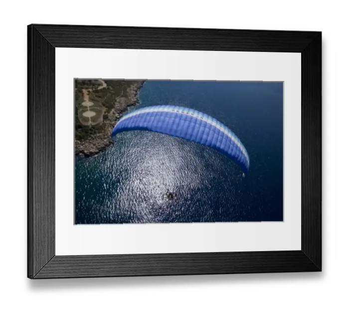 Framed Print : Powered paraglider flying over Kas, aerial view, Antalya, Turkey Framed Print : Powered paraglider flying over Kas, aerial view, Antalya, Turkey