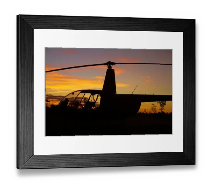 Framed Print : Australia. Robinson R44 helicopter at sunset, Jabiru East Airport