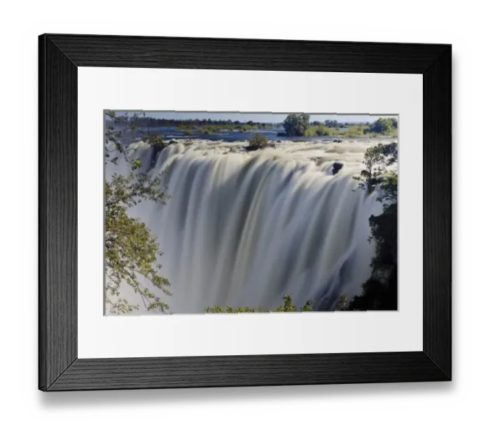 Framed Print : Victoria Falls or Mosi-oa-Tunya (the Smoke that Thunders) in Zambesi river is 108 meters Framed Print : Victoria Falls or Mosi-oa-Tunya (the Smoke that Thunders) in Zambesi river is 108 meters