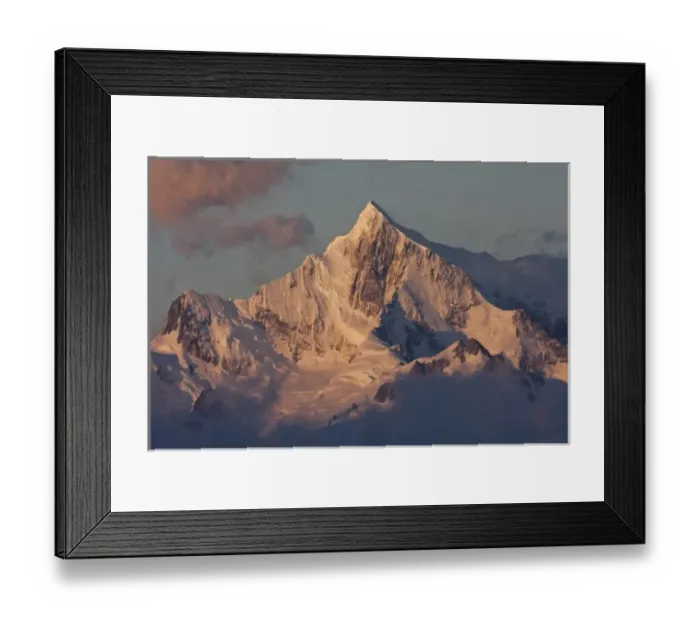 Framed Print : South Atlantic, South Georgia. Sunlit, snow-covered mountain peak at dawn. Credit as