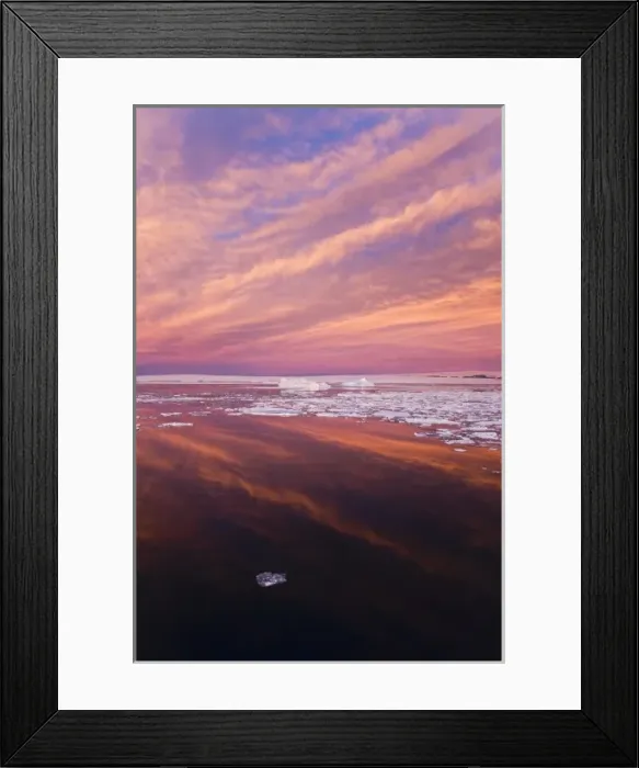 Framed Print : Huge iceberg and ice floes in the ocean at sunrise, Antarctica Framed Print : Huge iceberg and ice floes in the ocean at sunrise, Antarctica