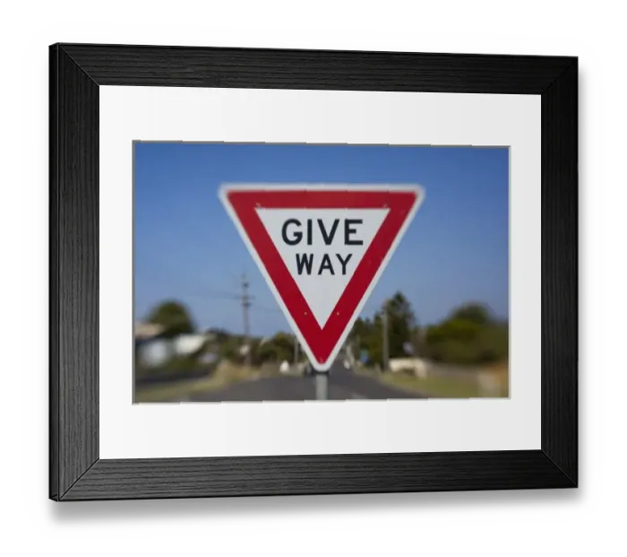Framed Print : Australia, Victoria, Port Campbell, Blurred image of Give Way road warning sign in