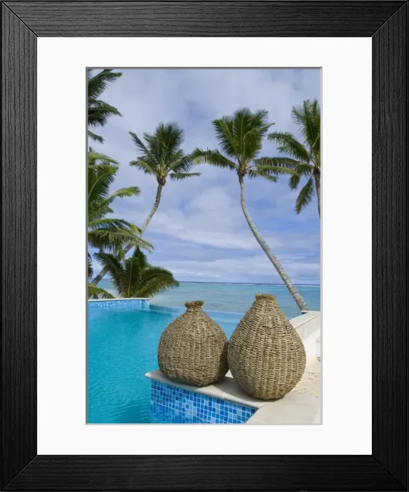 Framed Print : Cook Islands, Rarotonga. Hotel pool surrounded by palm trees