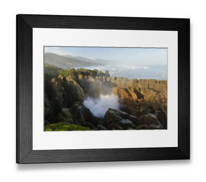 Framed Print : New Zealand, South Island, Paparoa National Park. Water emerging through blowhole at Pankace Rocks