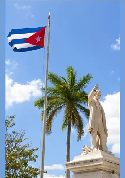 Cuban flag and statue in center of town of Jose Marti hero in CVienfuegos Cuba