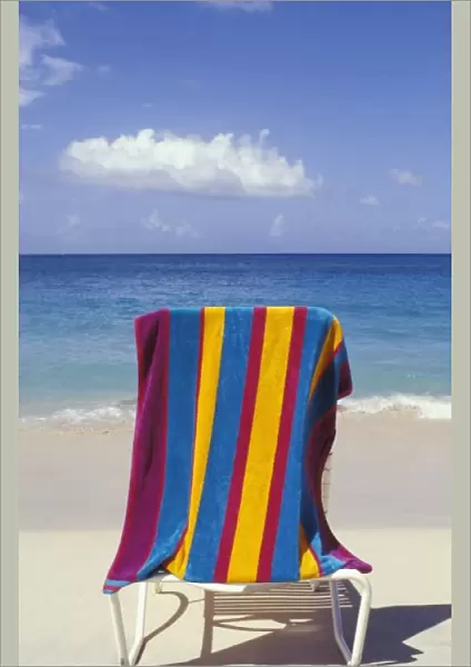 Caribbean, Grenada, Grand Anse beach. Beach towel on chair