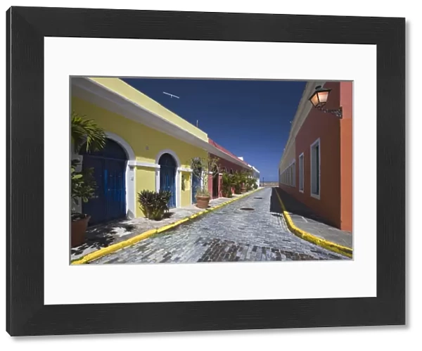 Caribbean, Puerto Rico, Old San Juan. Colorful houses on a cobblestone street