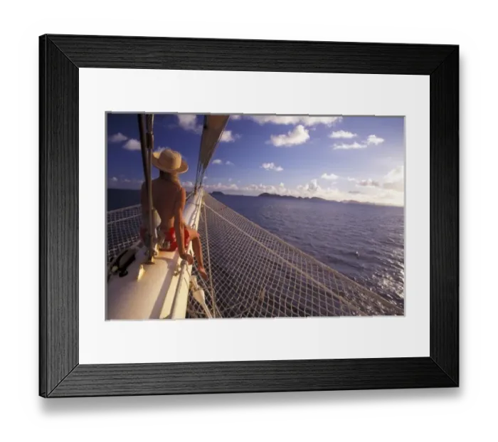 Framed Print : Caribbean. Passenger sitting on bow of Star Clipper (MR) Framed Print : Caribbean. Passenger sitting on bow of Star Clipper (MR)