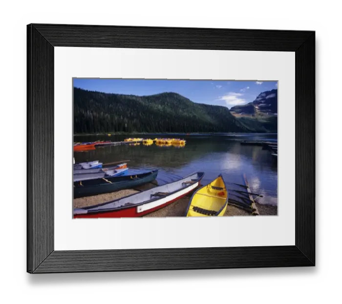 Framed Print : Canoes and pedal watercraft await tourists at Cameron lake in Waterton Lakes National Framed Print : Canoes and pedal watercraft await tourists at Cameron lake in Waterton Lakes National